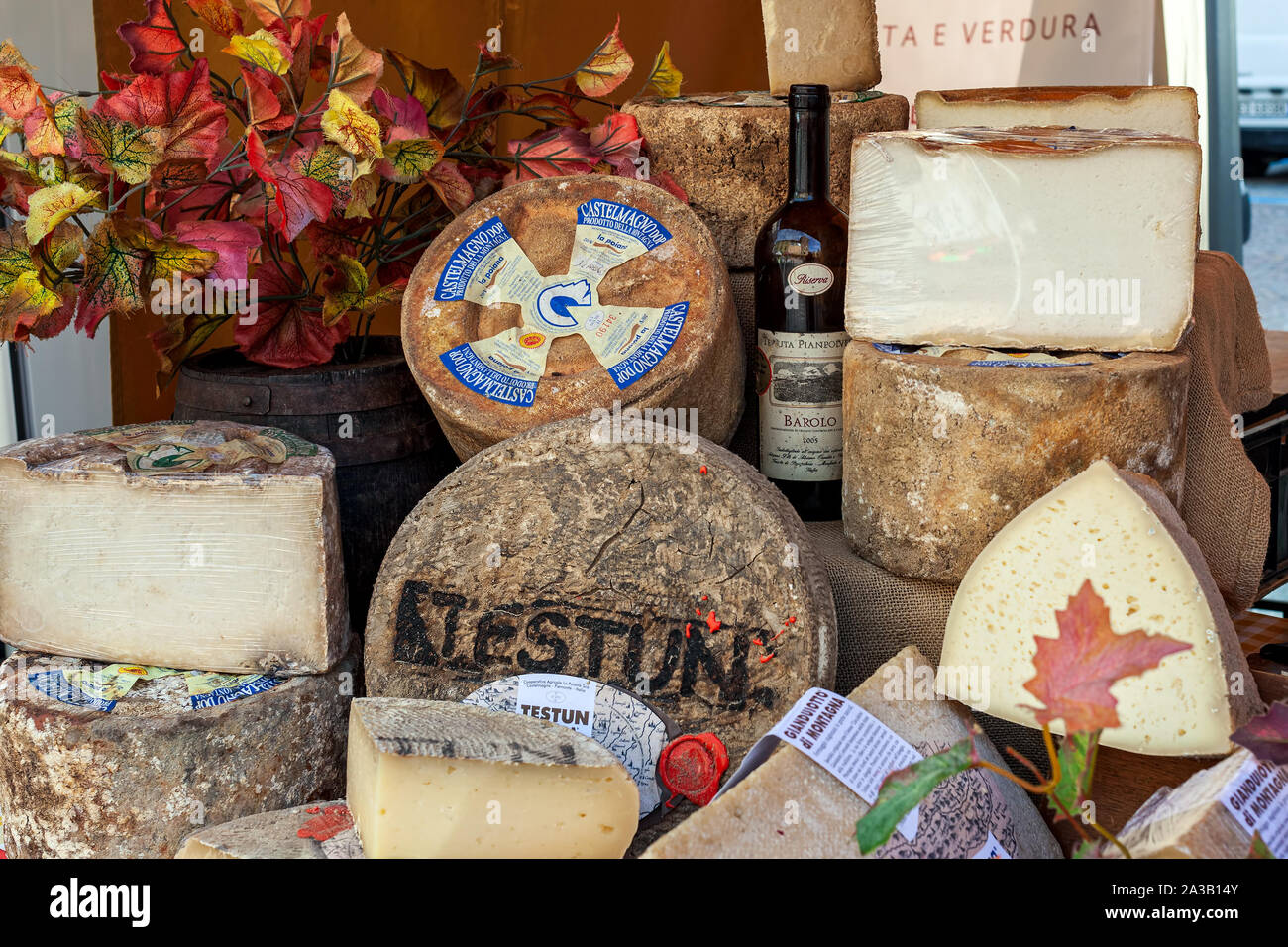 Different types of traditional italian semi-hard cheese at the market during annual famous White Truffle festival in Alba, Italy. Stock Photo