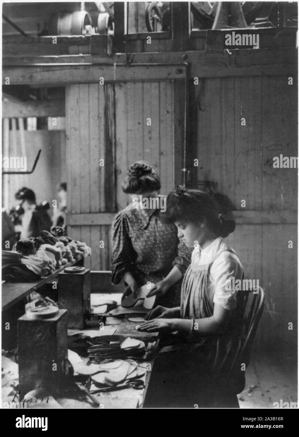 Shoe factories, Lynn, Mass. 2 women working in shoe factory Stock
