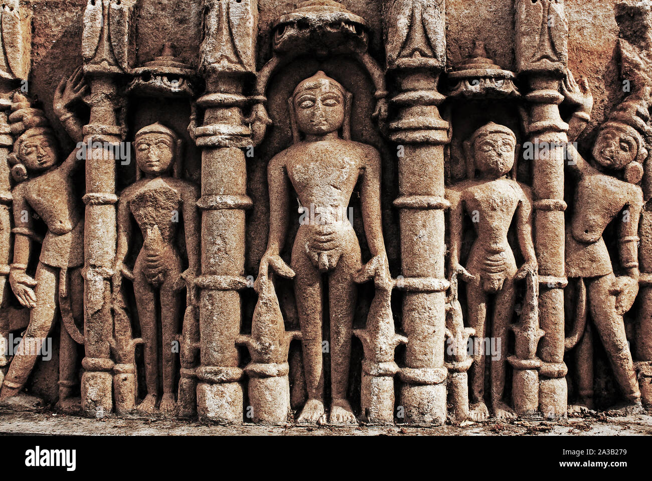 Ancient statues carved into the wall of a temple in Rajasthan, India