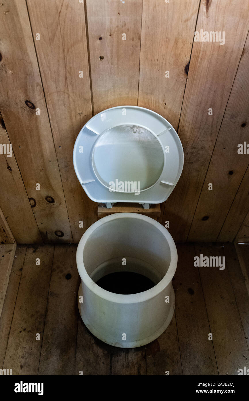 Rustic Latrine with hole in toilet in the middle of the woods, Gatineau