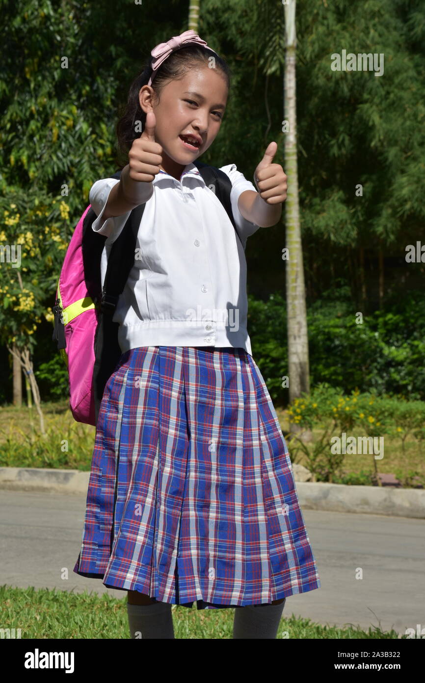 Girl Student With Thumbs Up With Books Stock Photo - Alamy
