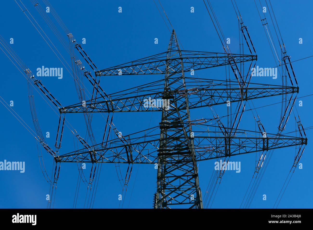 Electricity pylon and blue sky Stock Photo - Alamy