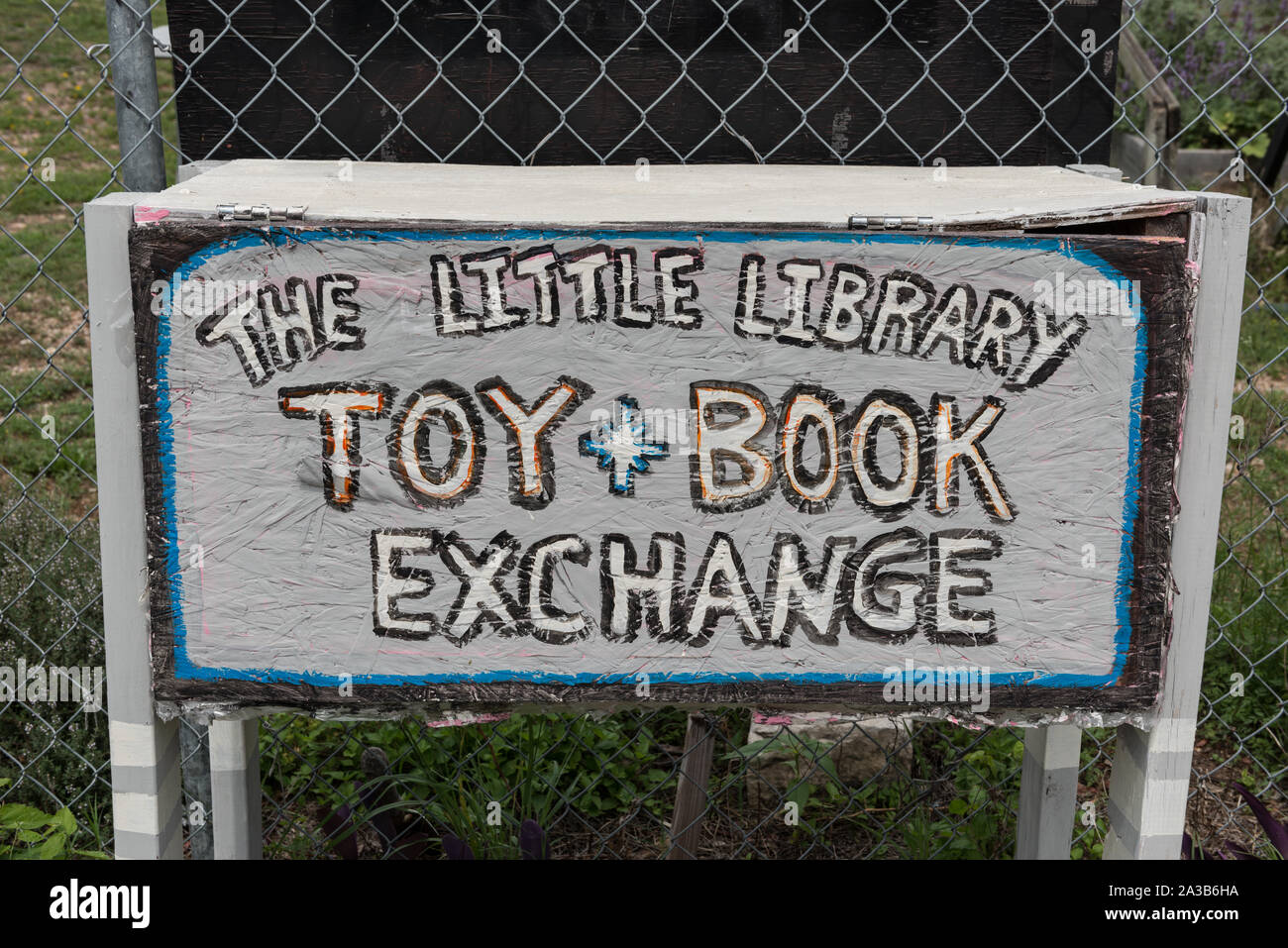 Sign for a toy-book exchange at one of the locations of the Little Free Library in Austin, Texas, where normally only books are given and taken Stock Photo