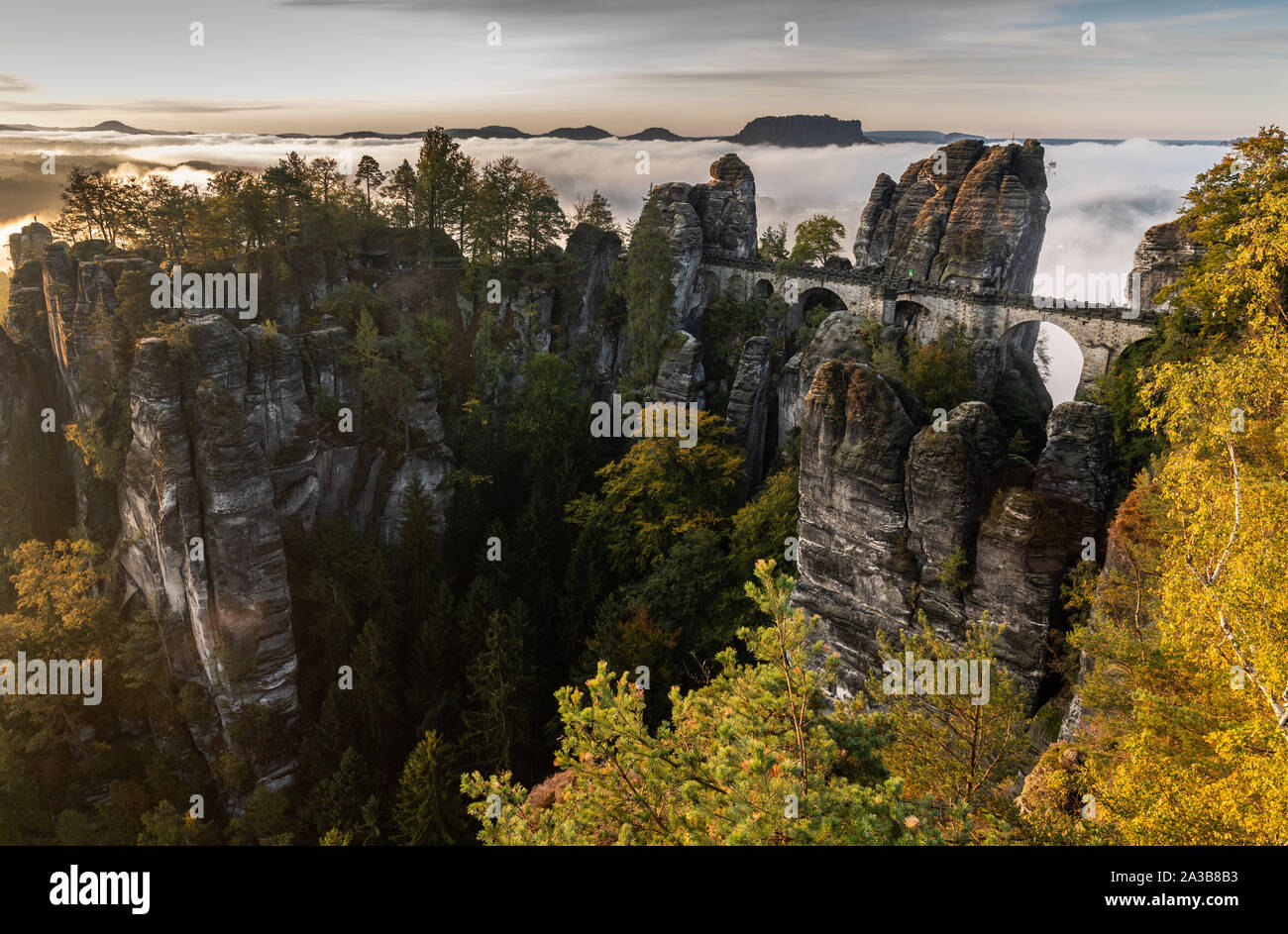 Dresden, Germany. 07th Oct, 2019. In the morning fog lies over the Saxon Switzerland National Park behind the bastion bridge built in 1851 and the 415-metre-high Lilienstein. Credit: Robert Michael/dpa-Zentralbild/dpa/Alamy Live News Stock Photo