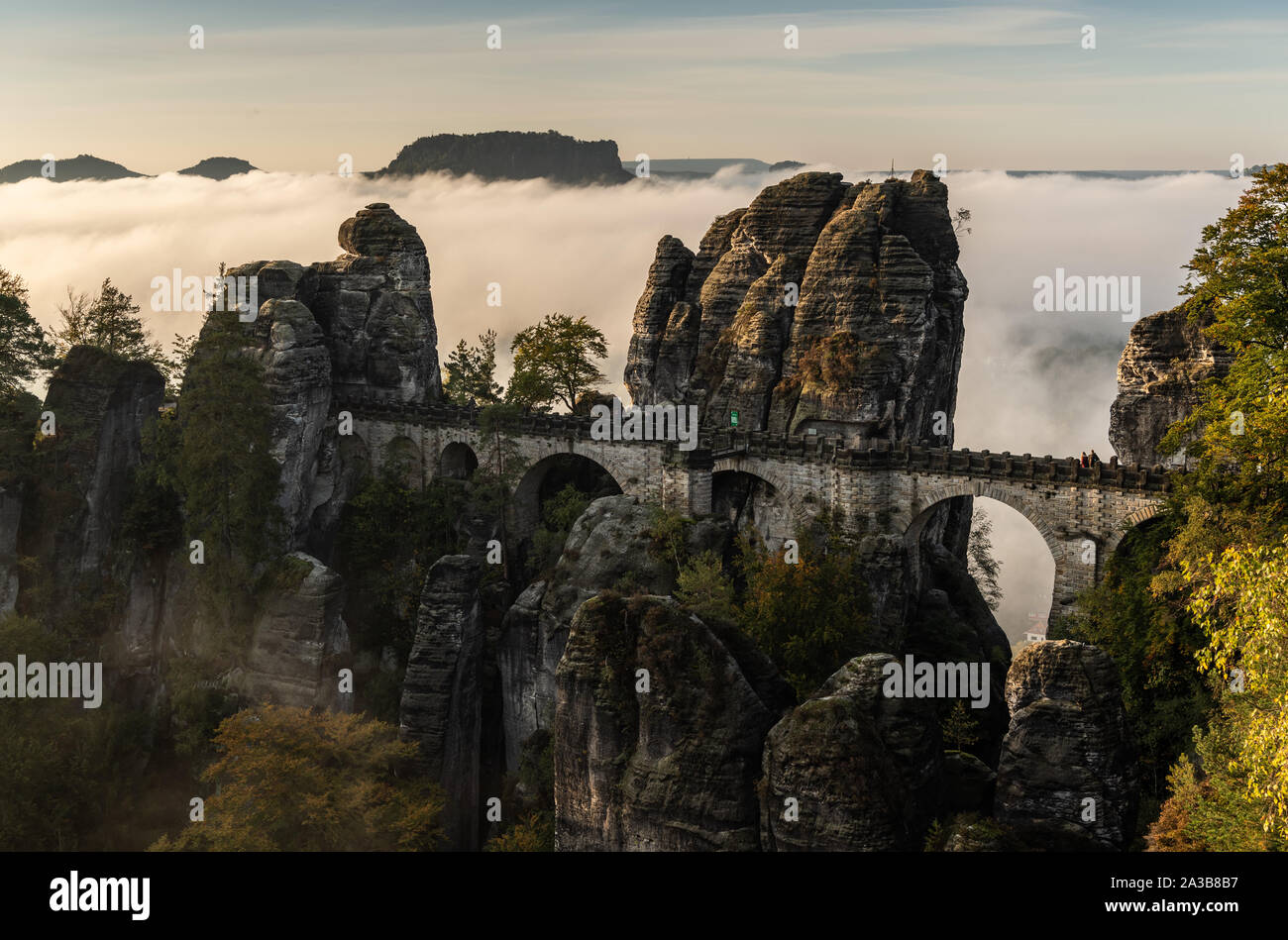 Dresden, Germany. 07th Oct, 2019. In the morning fog lies over the Saxon Switzerland National Park behind the bastion bridge built in 1851 and the 415-metre-high Lilienstein. Credit: Robert Michael/dpa-Zentralbild/dpa/Alamy Live News Stock Photo
