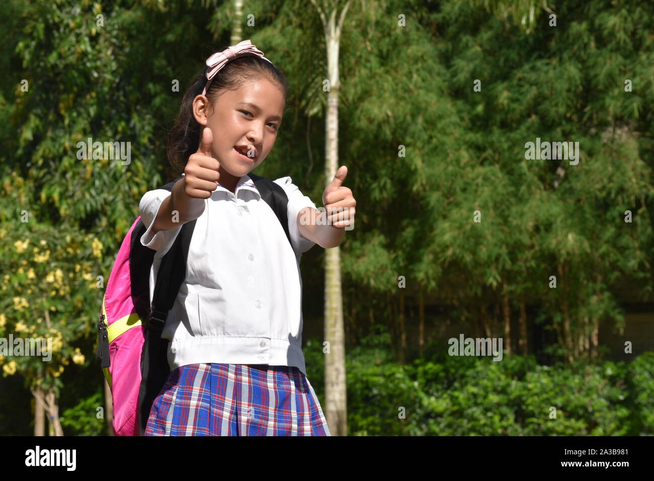 Cute Diverse Girl Student With Thumbs Up Stock Photo - Alamy