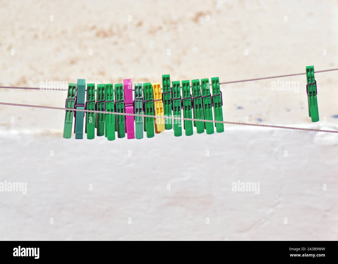 Background of colored clothespins on wire Stock Photo