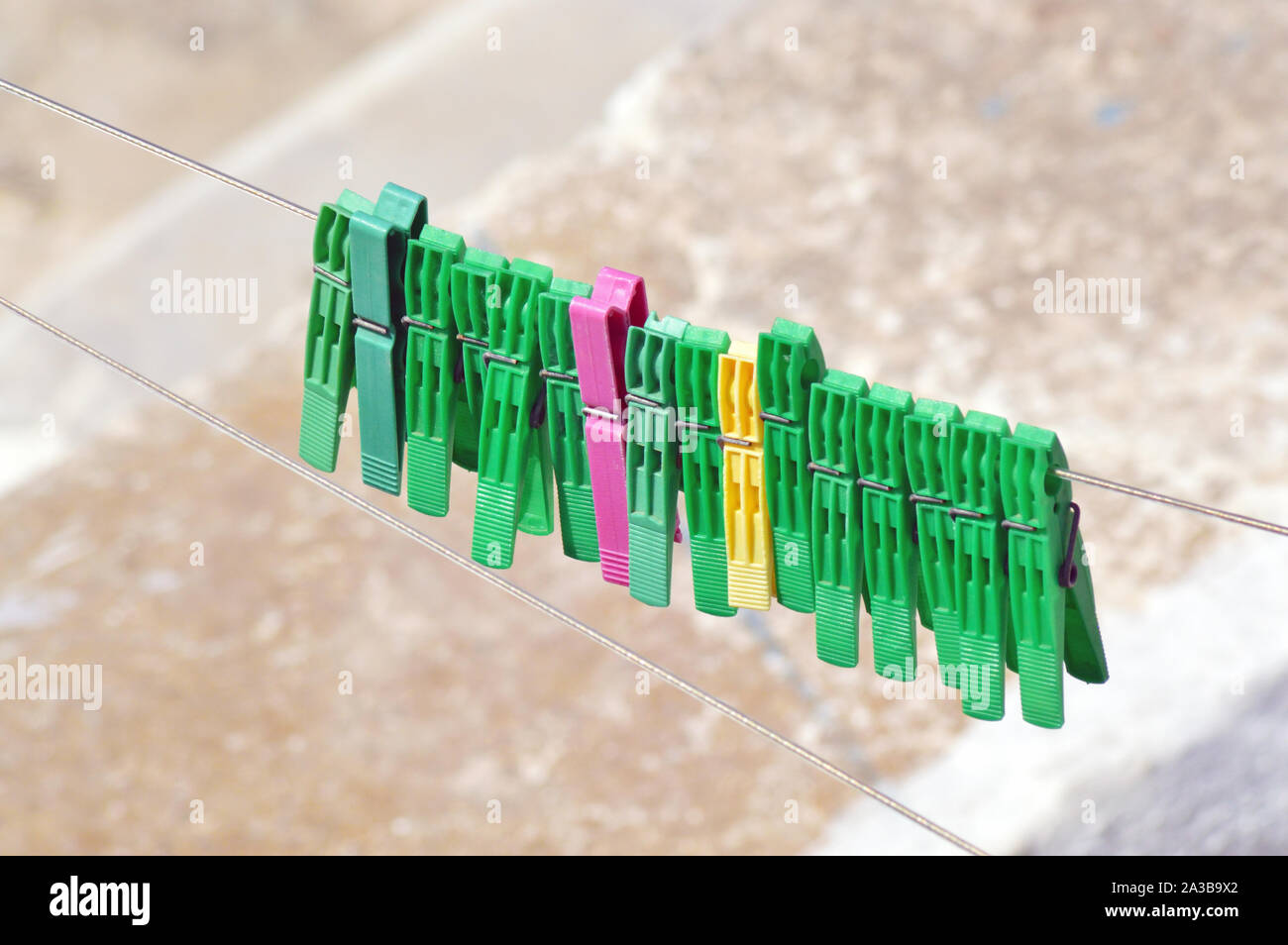 Background of colored clothespins on wire Stock Photo