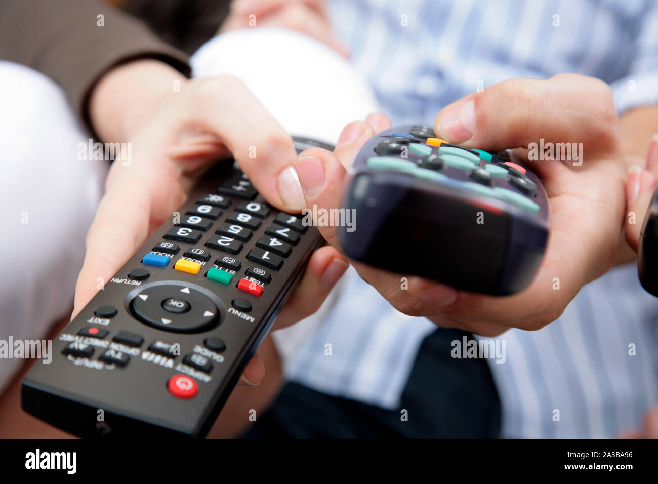 hands with remote controls Stock Photo Alamy