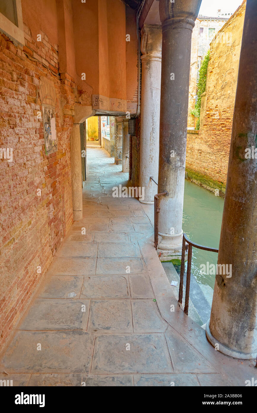 VENICE, ITALY - CIRCA MAY, 2019: pedestrian way at canal waterfront seen in Venice. Stock Photo