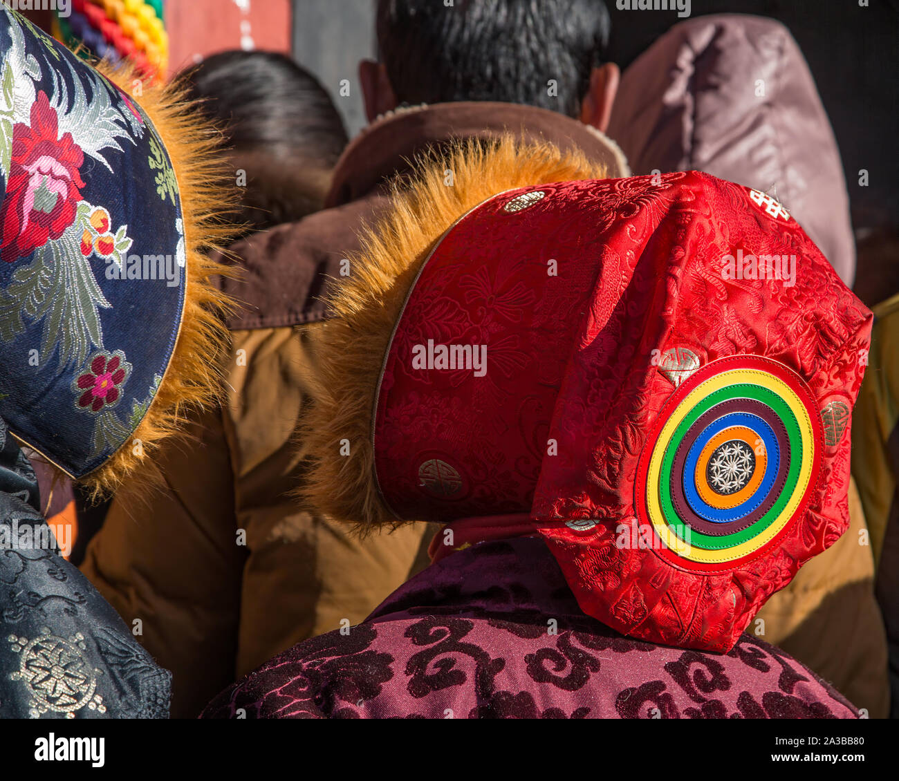 A Tibetan woman in a silk hat lined with red fox fur called a Lhakkya