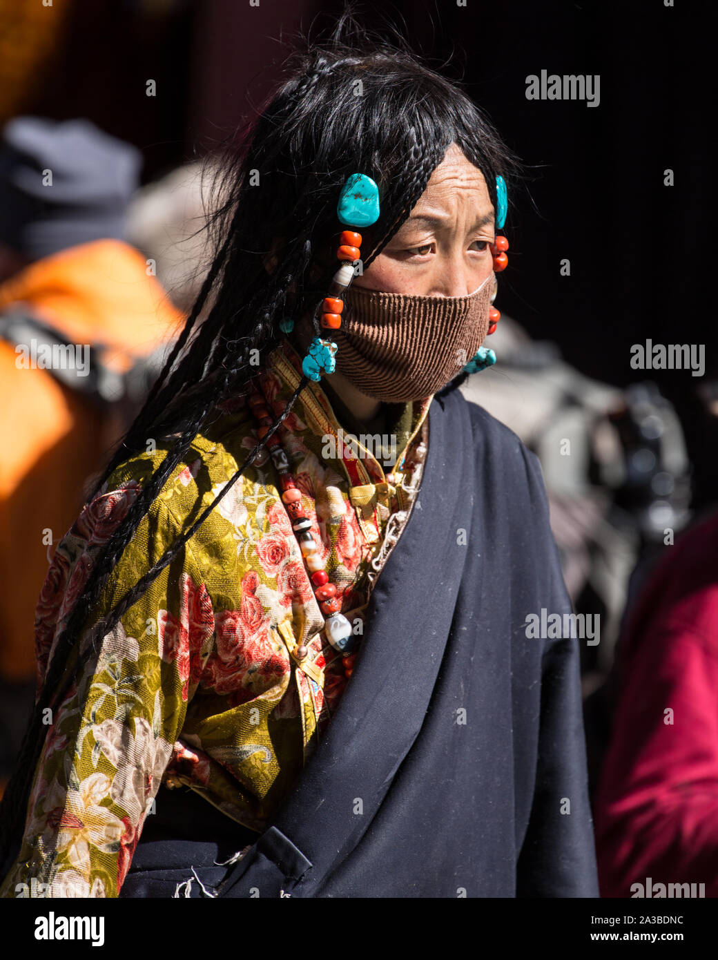 A young Khamba Tibetan woman from the Kham region of Tibet with her