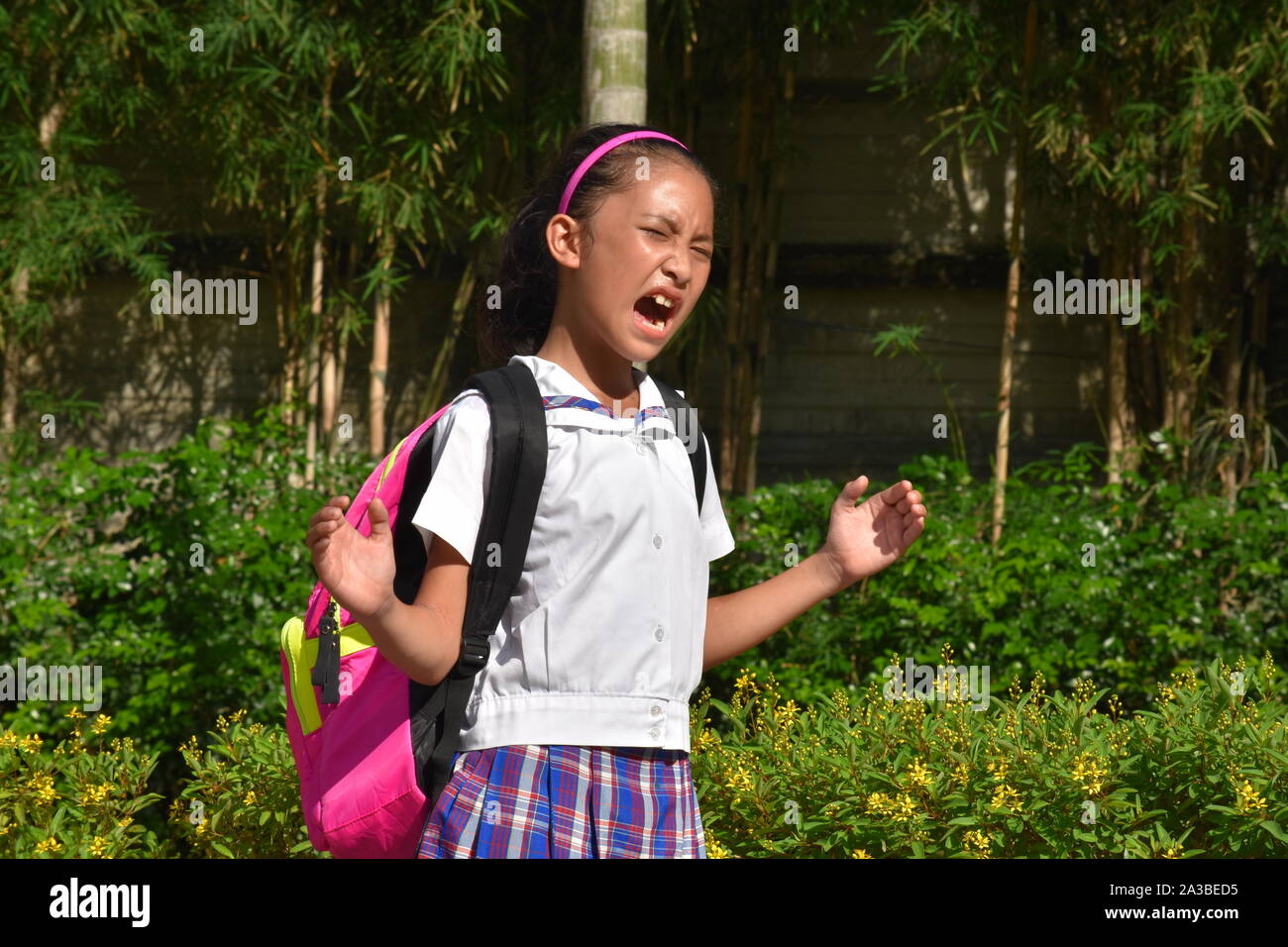 A Girl Student Yelling Wearing Uniform Stock Photo