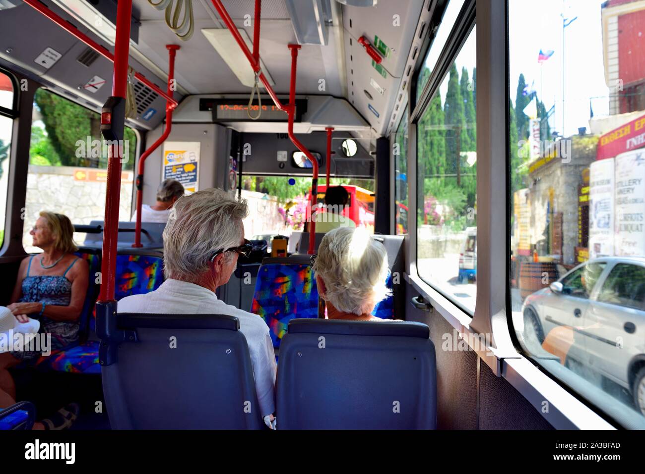 Elderly senior married couple,using a local bus service,Corfu,Kerkyra,Kerkira,Ionian islands,Greece Stock Photo