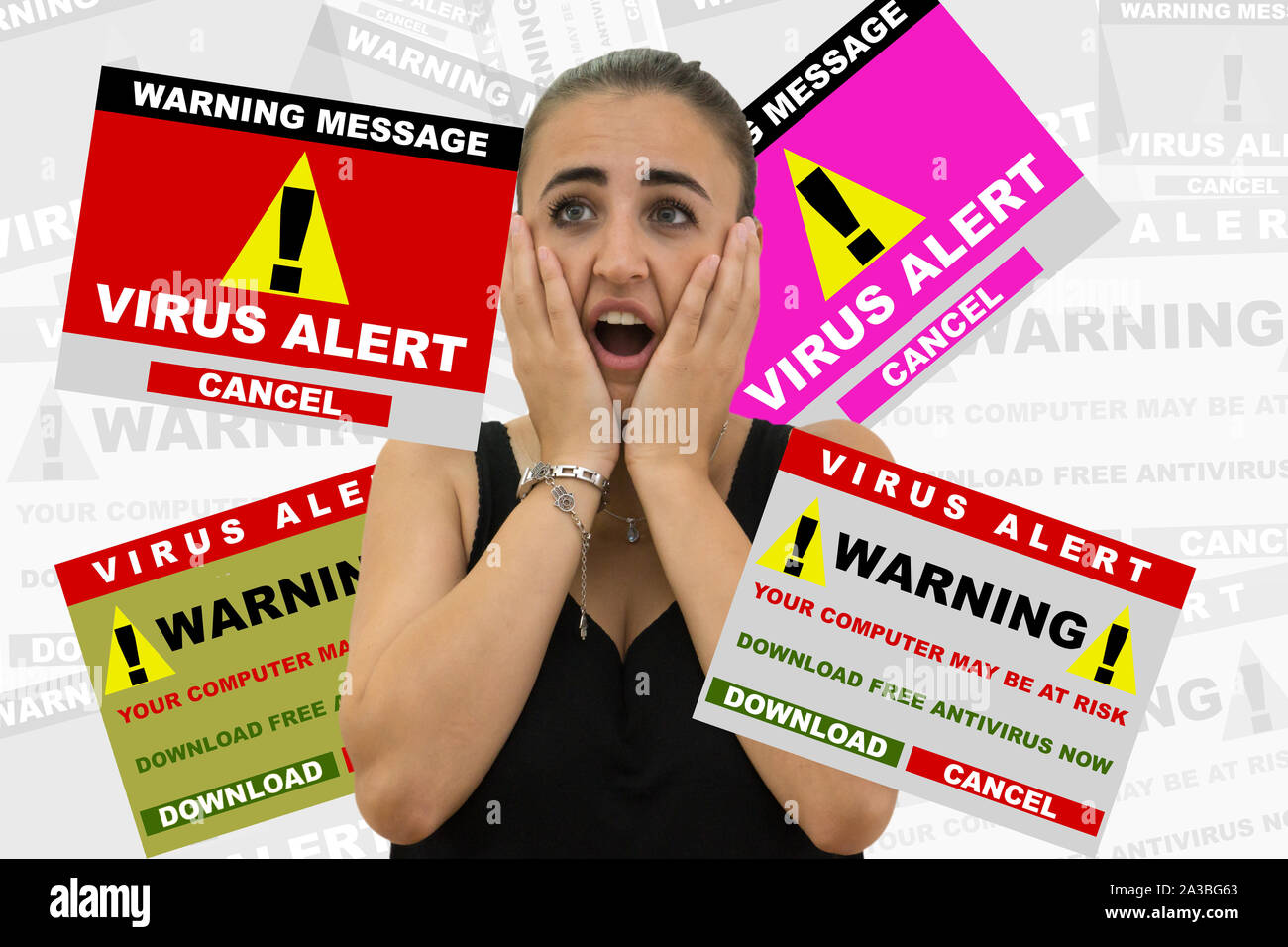 Young woman scared by various virus alert signal. Internet security concept Stock Photo