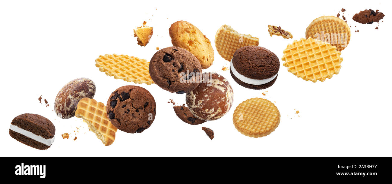 Falling cakes, cookies, crackers, waffles isolated on white background Stock Photo