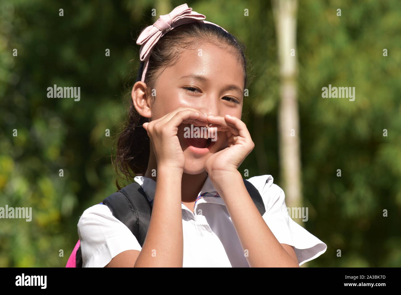 A Girl Student Yelling With Notebooks Stock Photo