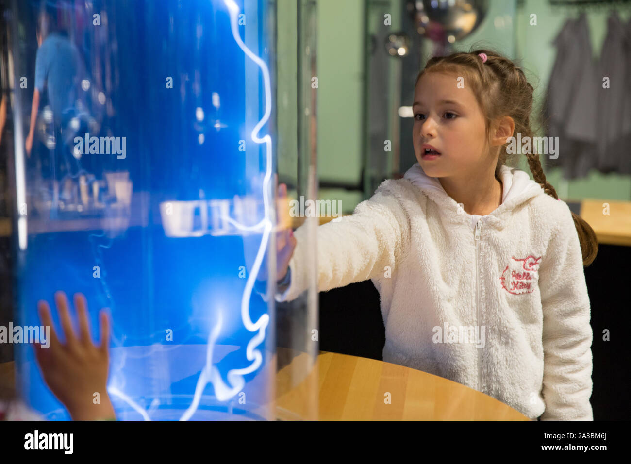 Helsinki, Finland - June 10, 2019: Finnish science center Heureka in Vantaa. Child studying electrical discharges in a lab. Stock Photo