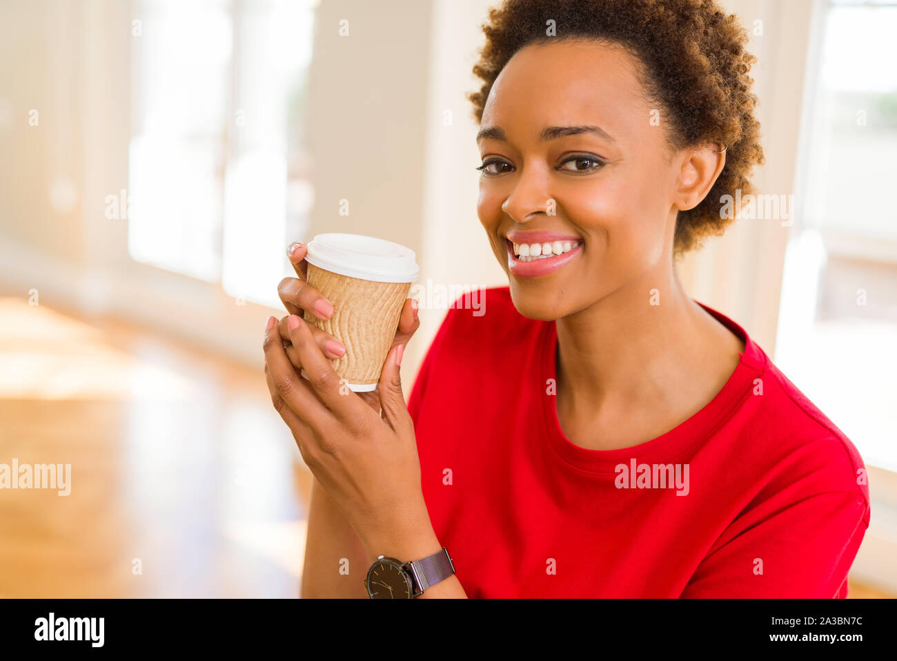 https://c8.alamy.com/comp/2A3BN7C/beautiful-young-african-american-woman-drinking-a-coffee-in-a-take-away-paper-cup-2A3BN7C.jpg