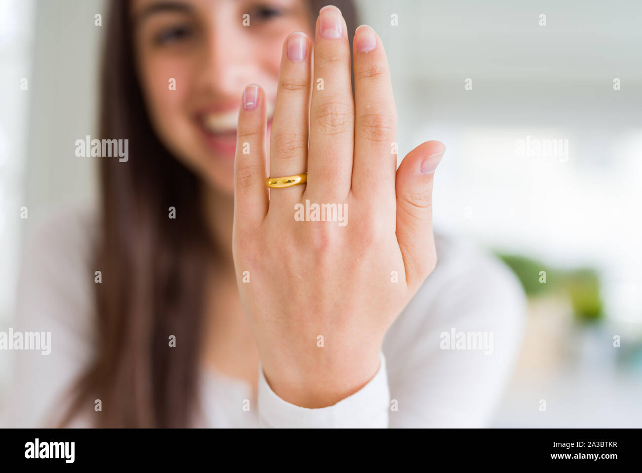 Woman hand touching her ring on finger Stock Photo by stockfilmstudio