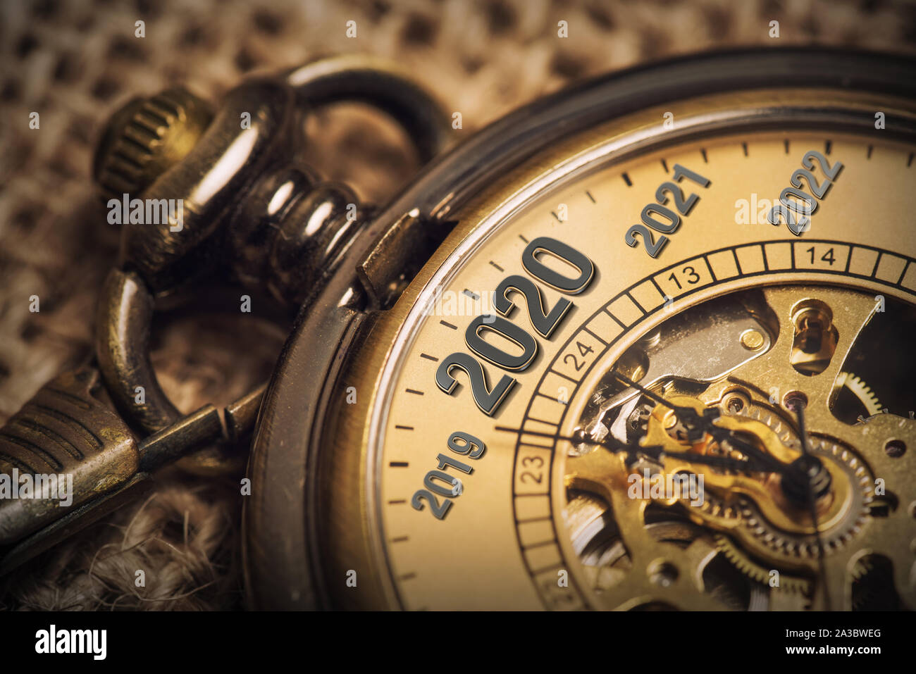Expecting the new year 2020 with a metaphor of ticking pocket watch. Stock Photo