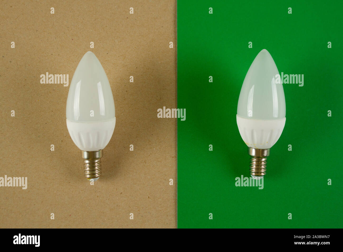 Old light bulb vs energy saving one concept Stock Photo Alamy