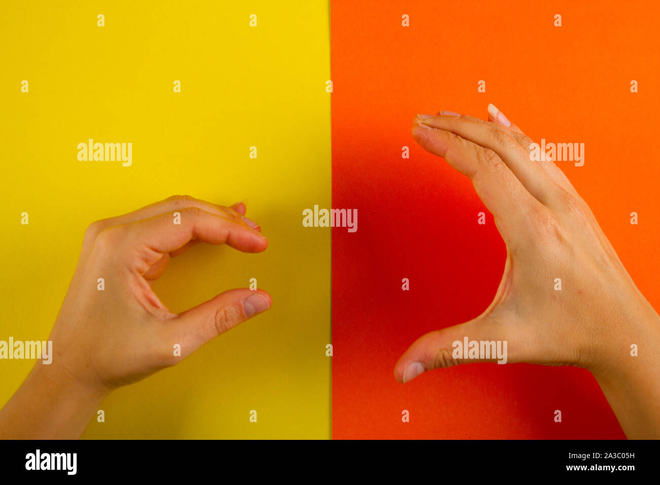 Big vs small. Two hand showing small and big gesture Stock Photo - Alamy