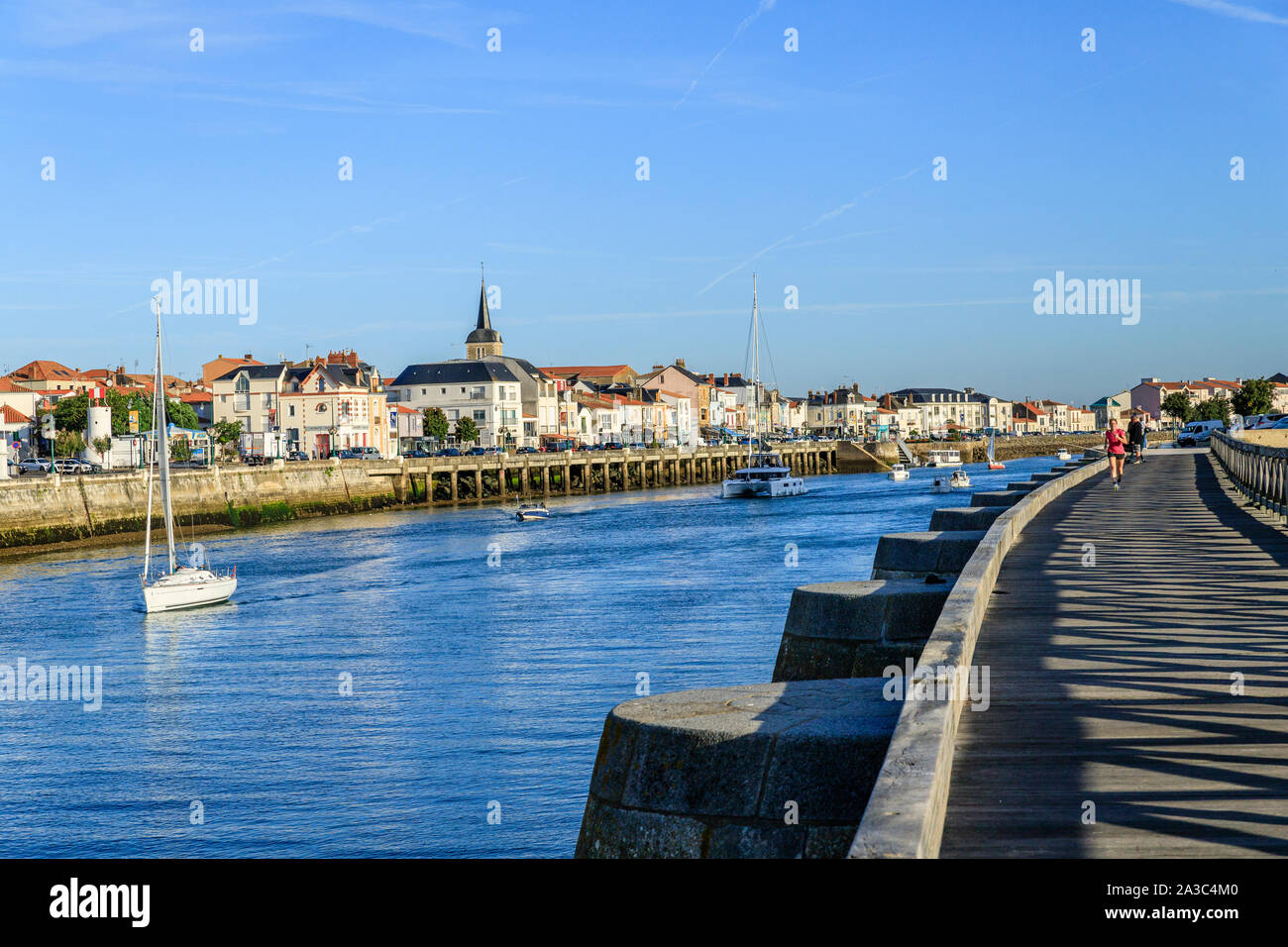 France, Vendee, Les Sables d'Olonne, channel, wooden dyke and La Chaume district on the other side // France, Vendée (85), Les Sables-d'Olonne, chenal Stock Photo