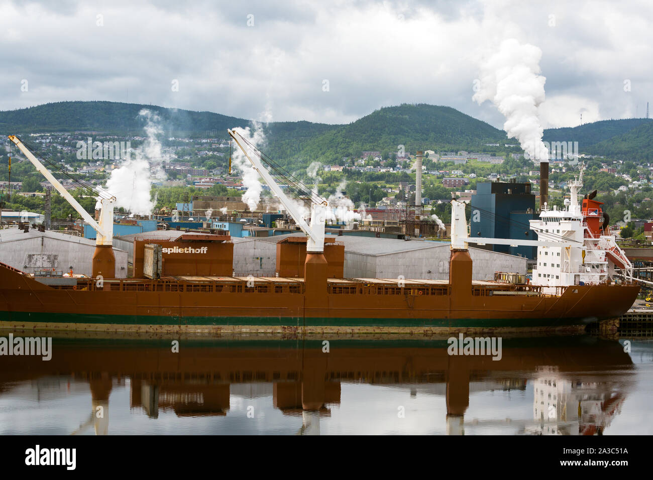 Cargo ship loading paper at paper mill at Corner Brook Newfoundland