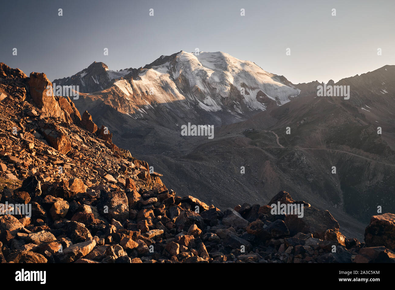 Landscape of Molodejniy peak in Tian Shan Mountains at sunset in Kazakhstan Stock Photo
