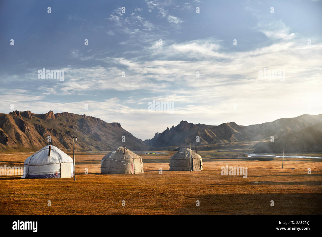 Yurt nomadic houses camp at mountain valley in Central Asia Stock Photo