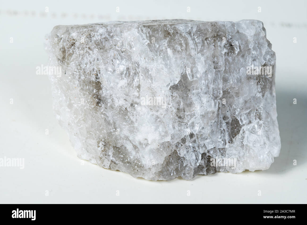 Piece of salt composed mineral, crystal stone salt isolated on white background Stock Photo
