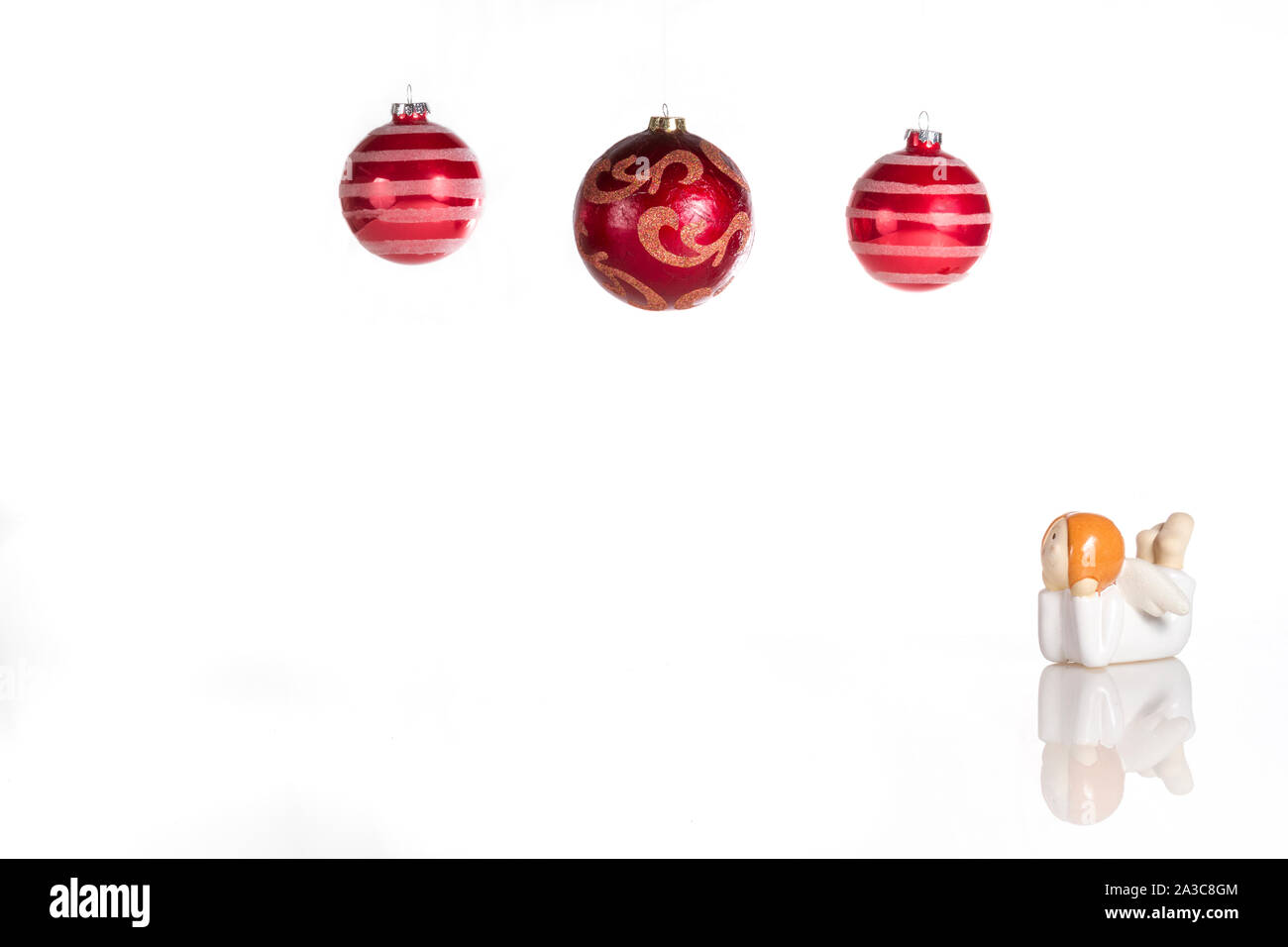composition of Christmas decorations with angel and Christmas ball in white background Stock Photo
