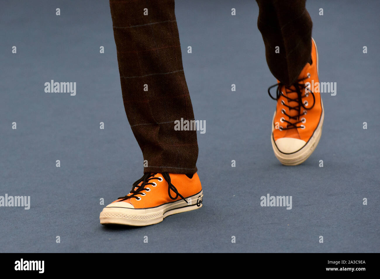 Visitors to the Frieze Masters art fair in Regent's Park, London wear arty designer trainers Stock Photo