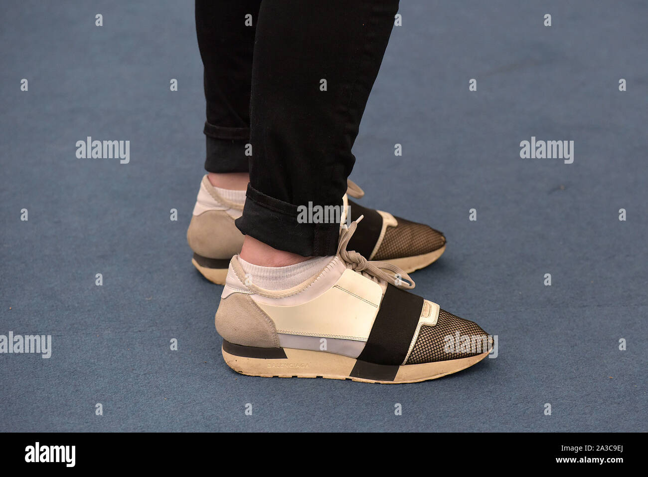 Visitors to the Frieze Masters art fair in Regent's Park, London wear arty designer trainers Stock Photo