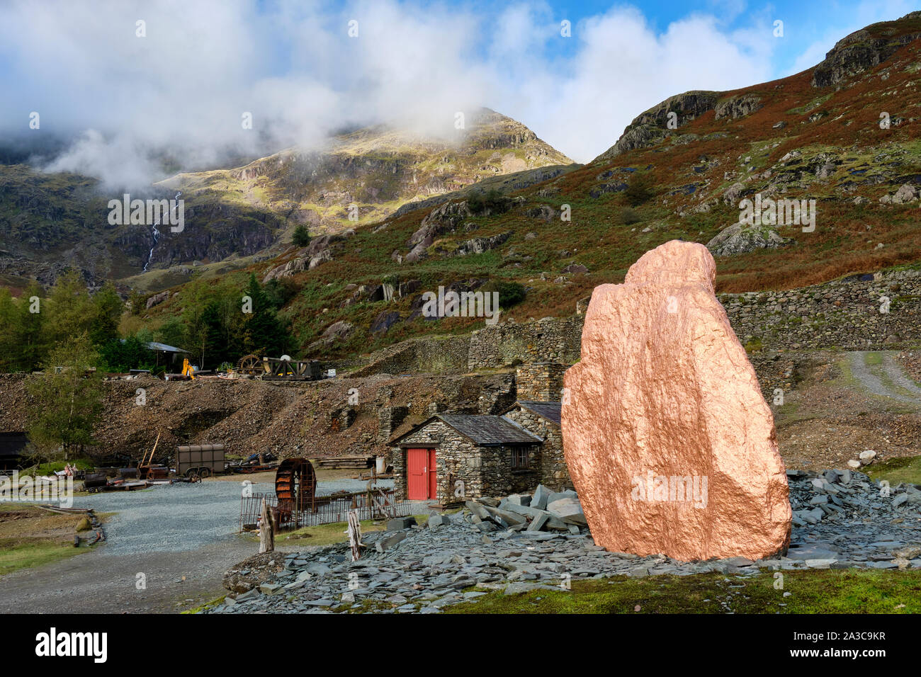 Copper painted rock, part of the Copper in our Veins art trail in the Coppermines Valley, Coniston, Lake District, Cumbria Stock Photo