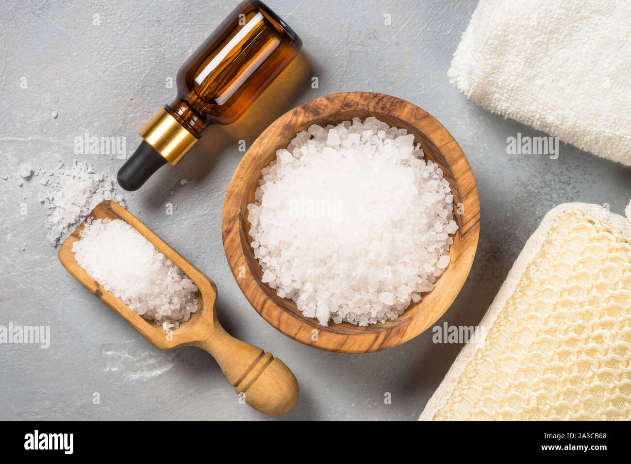 Sea salt and cosmetic oil on gray stone background Stock Photo Alamy