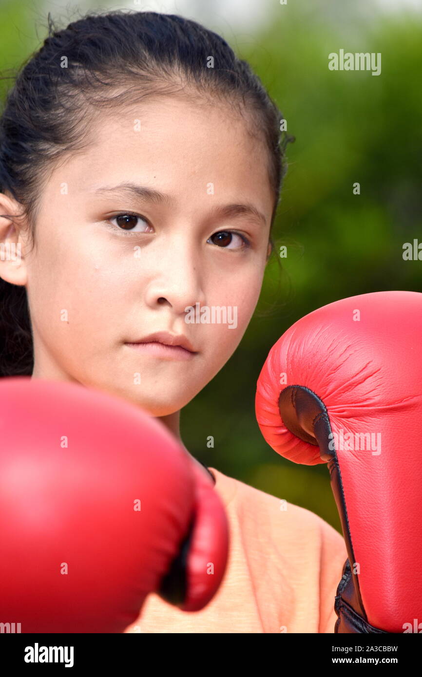 Unemotional Female Boxer Wearing Boxing Gloves Stock Photo