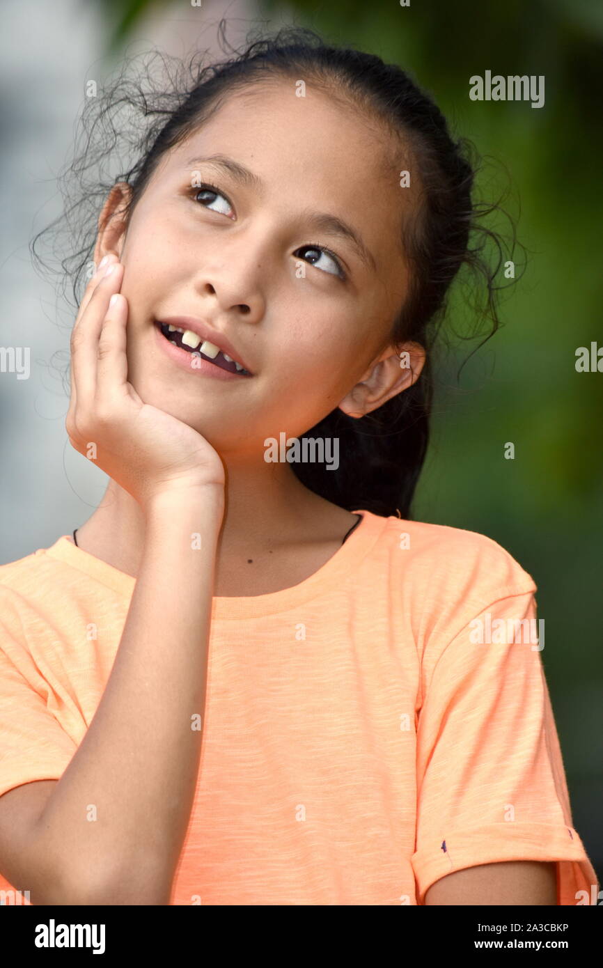 A Youthful Asian Girl Deciding Stock Photo