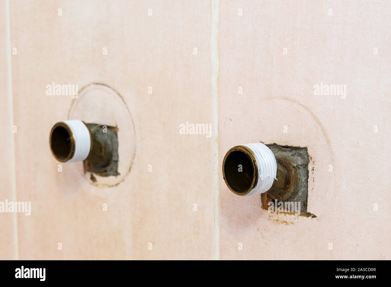 The plumber puts Teflon seam FUM tape on the thread before installing