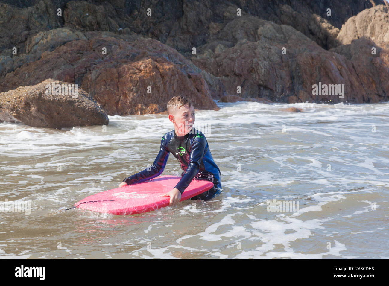 Boy Swimming Sea Wetsuit High Resolution Stock Photography and Images