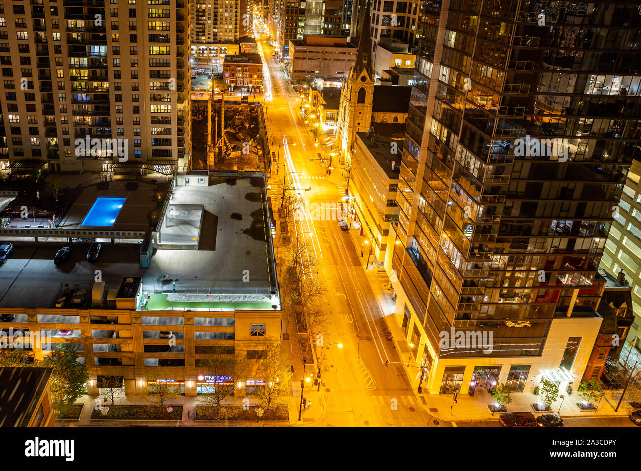 Chicago, Illinois, USA, May 9, 2019. Above view of skyscrapers in Chicago. Glass buildings reflecting the lights of the highway at night. Stock Photo