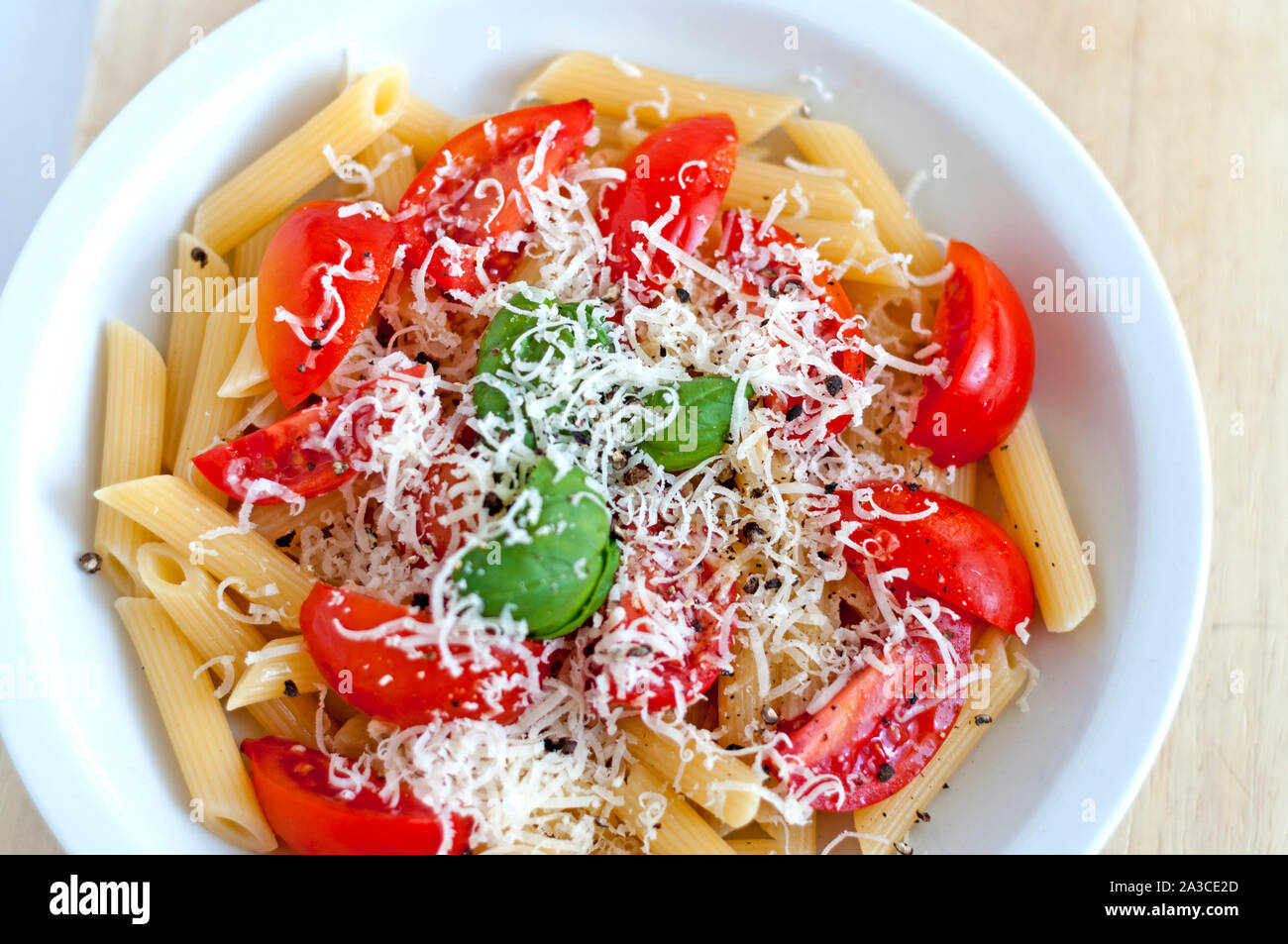 Pasta with tomato basil and parmisan: Italian flag ready to eat Stock Photo