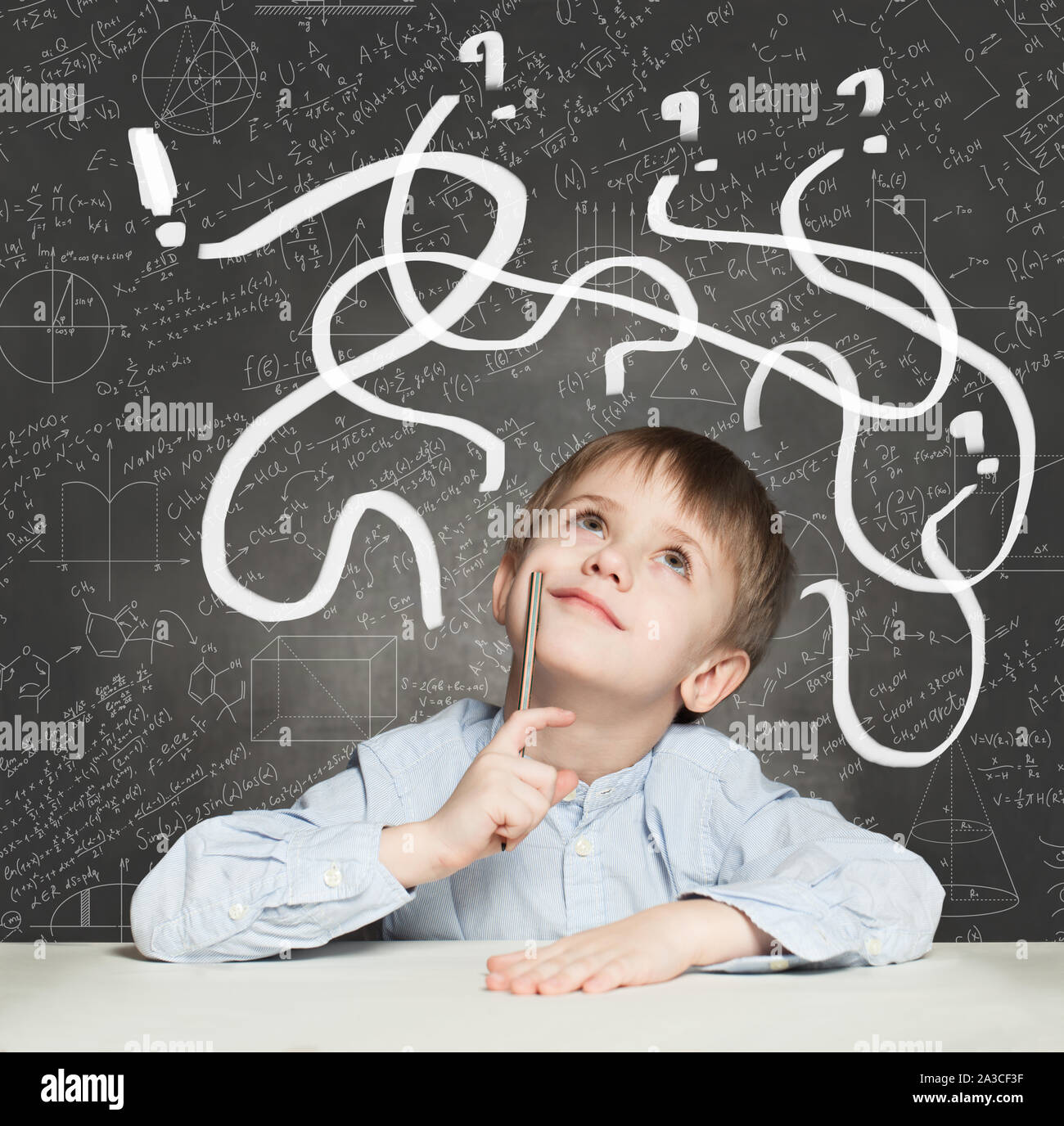 School Boy has an idea. Education Concept with question signs Stock ...