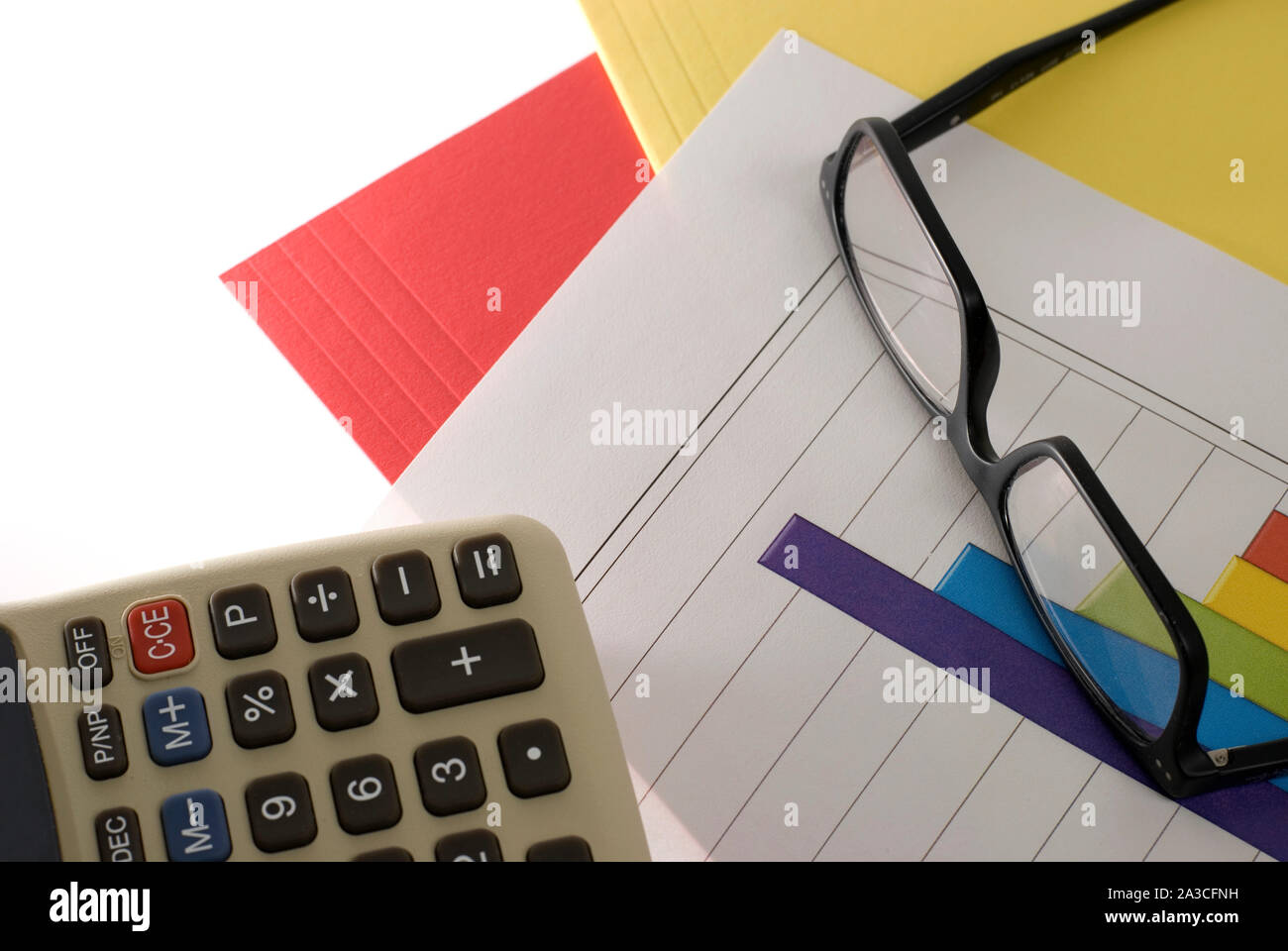 Calculator, Pen and Financial Graphs on White Stock Photo Alamy