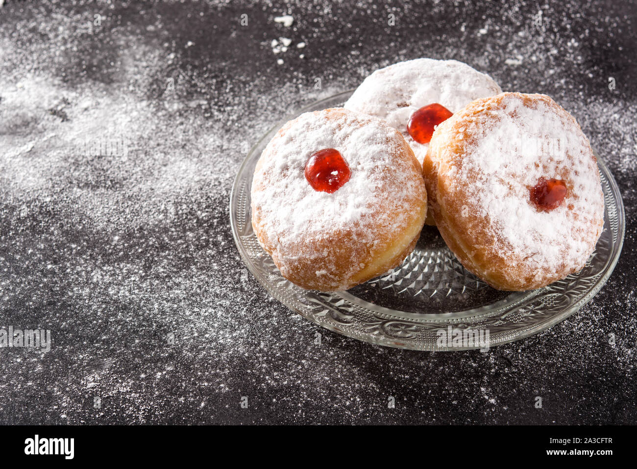Hanukkah sufganiyot. Traditional Jewish donuts for Hanukkah. Copy space Stock Photo