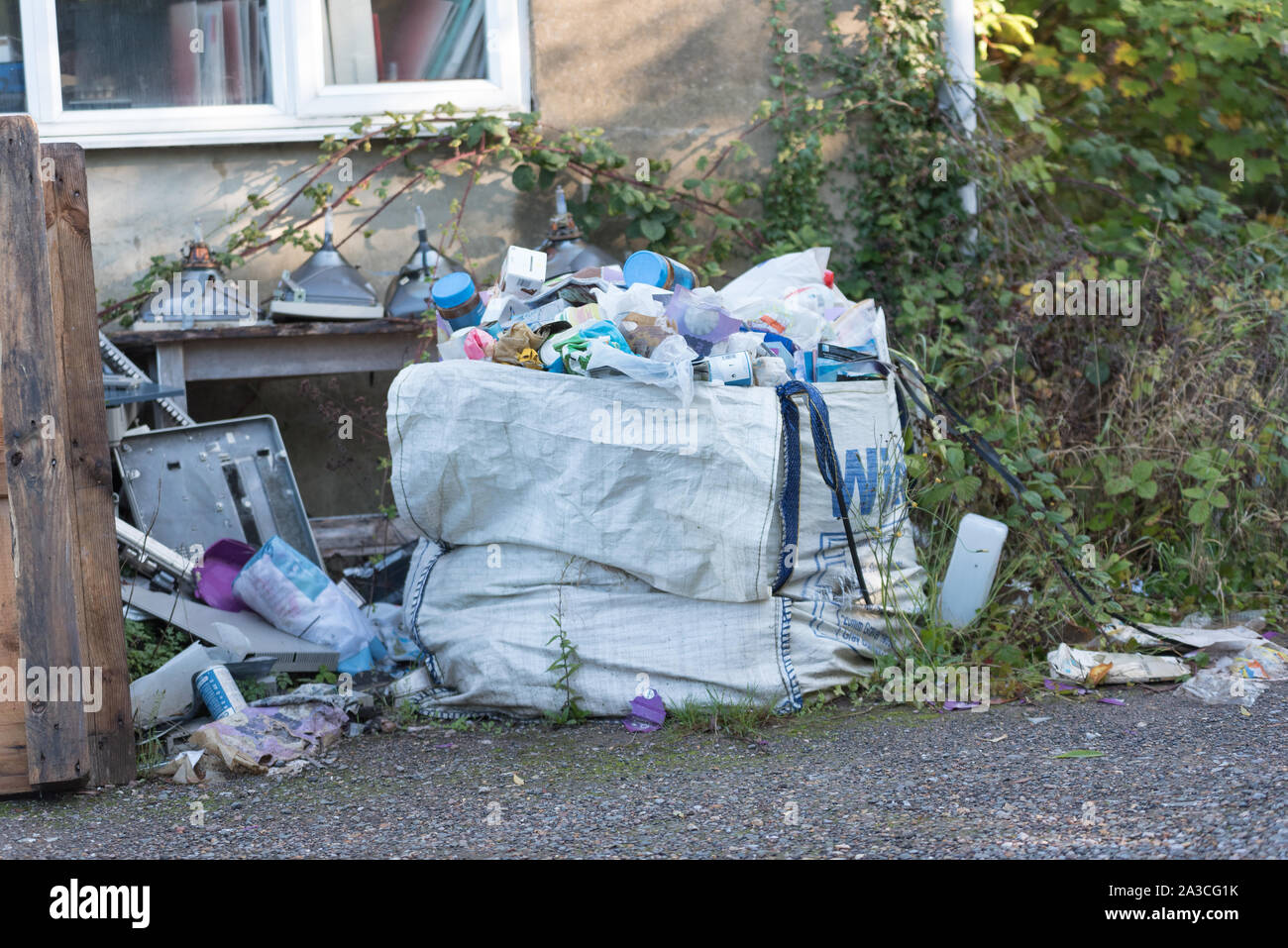 rubbish tipped on side of road in countryside Stock Photo