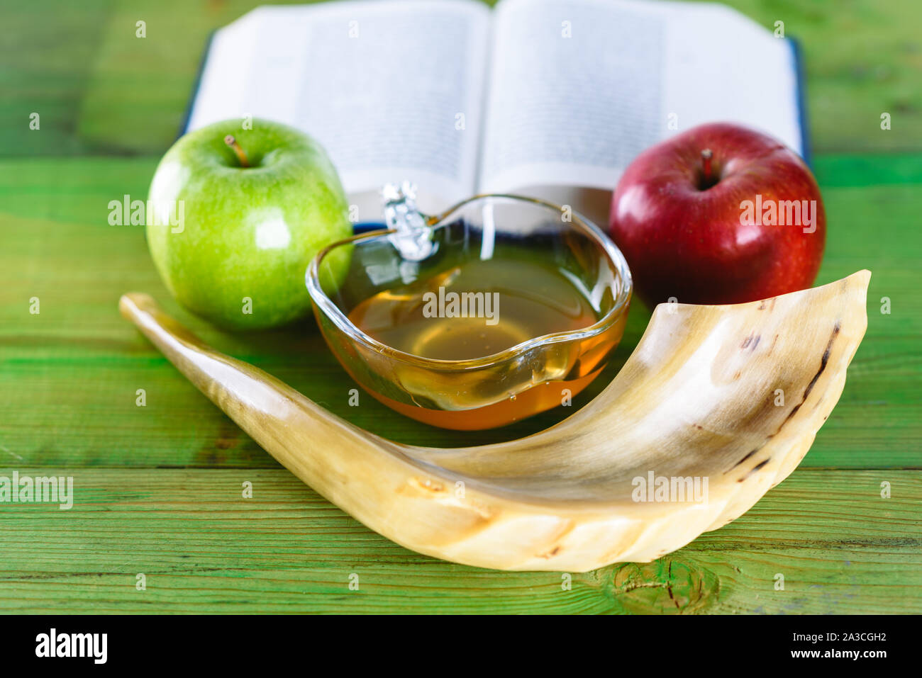 Rosh Ha Shana Jewish new year composition of an red and green apple