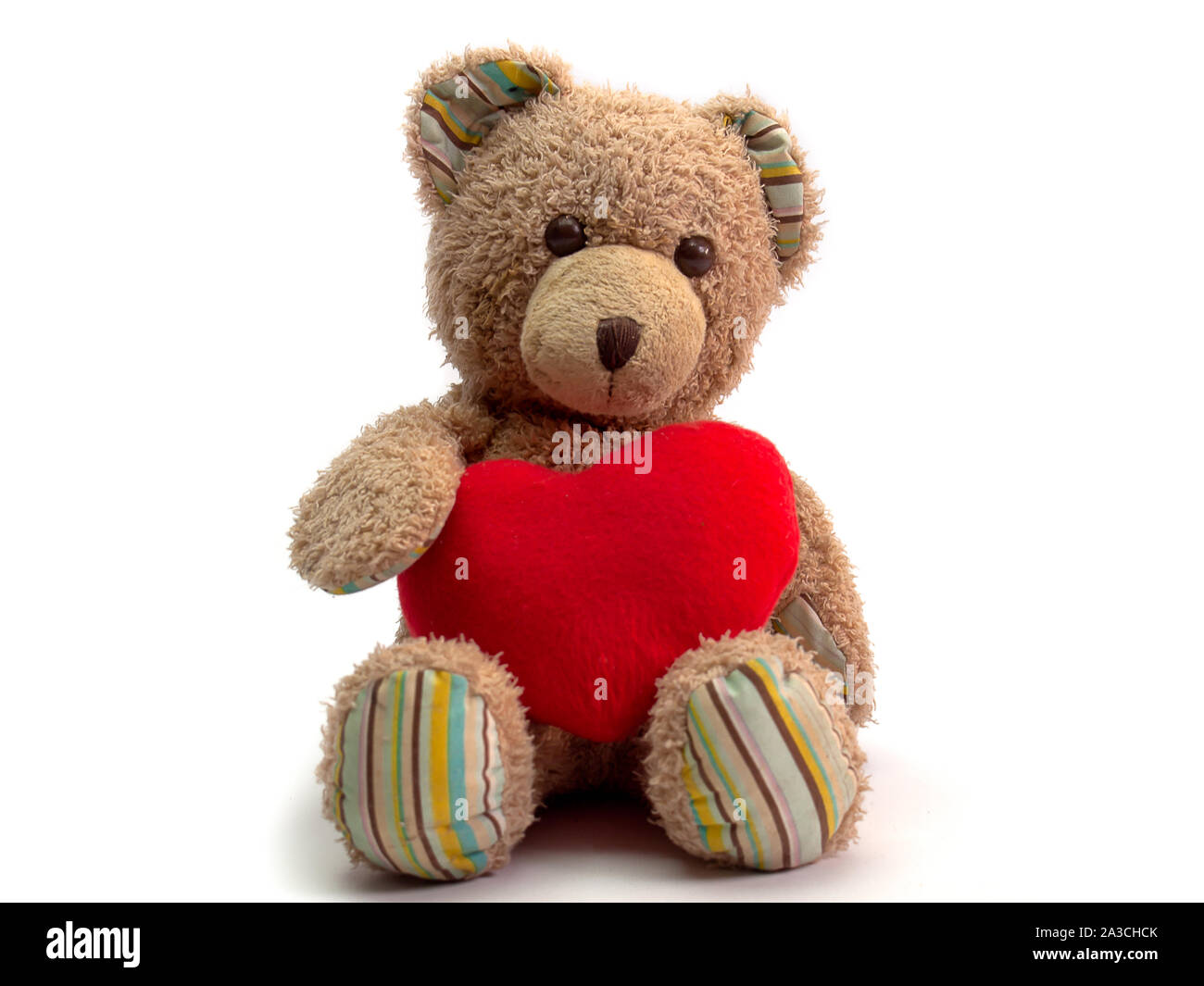 Teddy bear with heart , Placed on a white background Stock Photo - Alamy