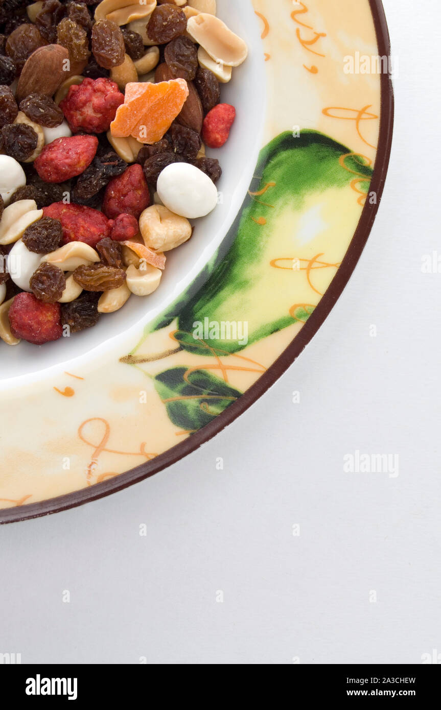 Mixed Nuts and Dried Mango in a Dish Stock Photo